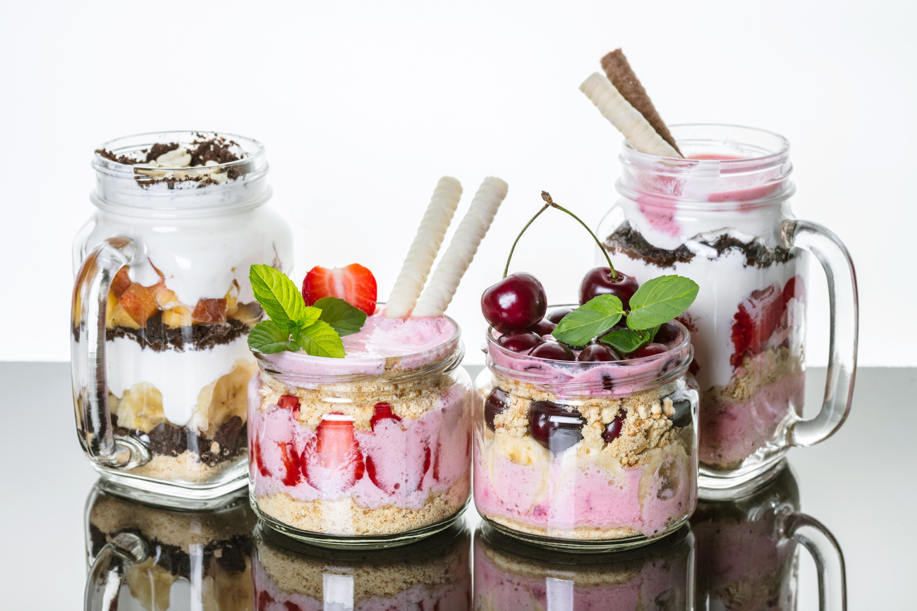 Fruit desserts in a jar with reflection